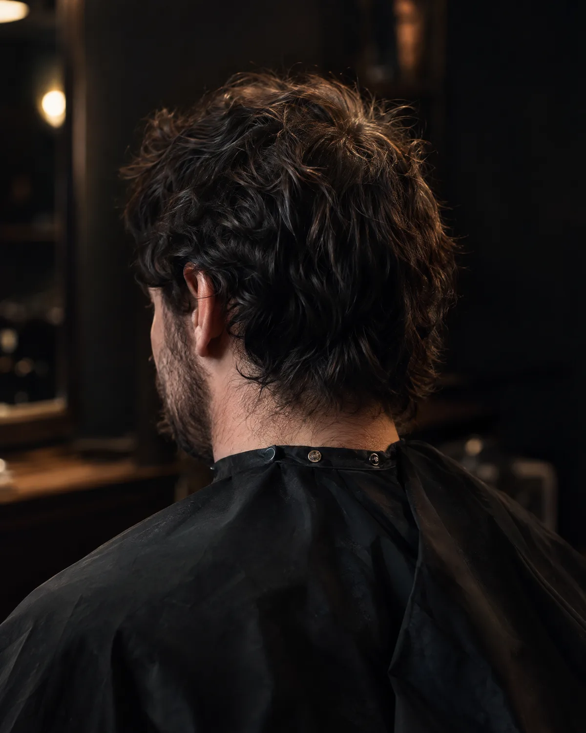 Overgrown hair at the back and sides before the cut