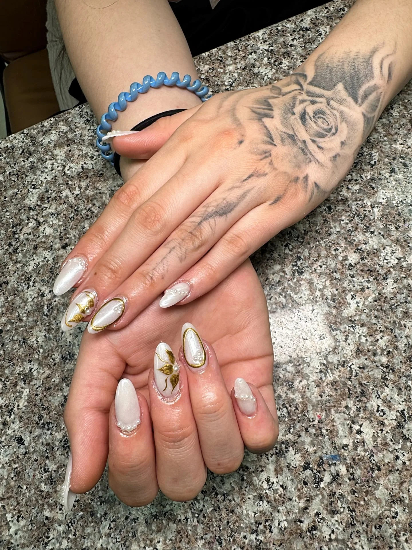 Red and gold nail design at Perfect Nails salon