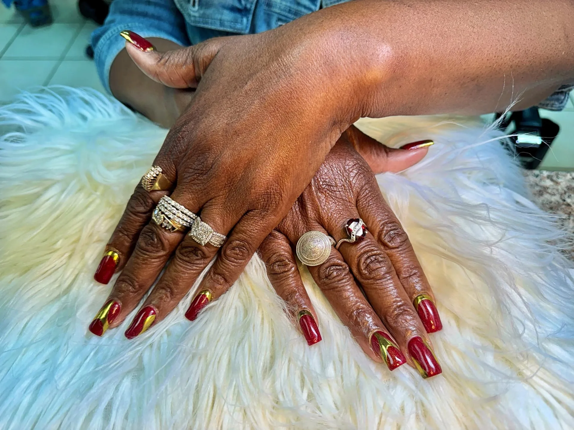Perfect Nails technician applying detailed nail art for a client in Saint Paul