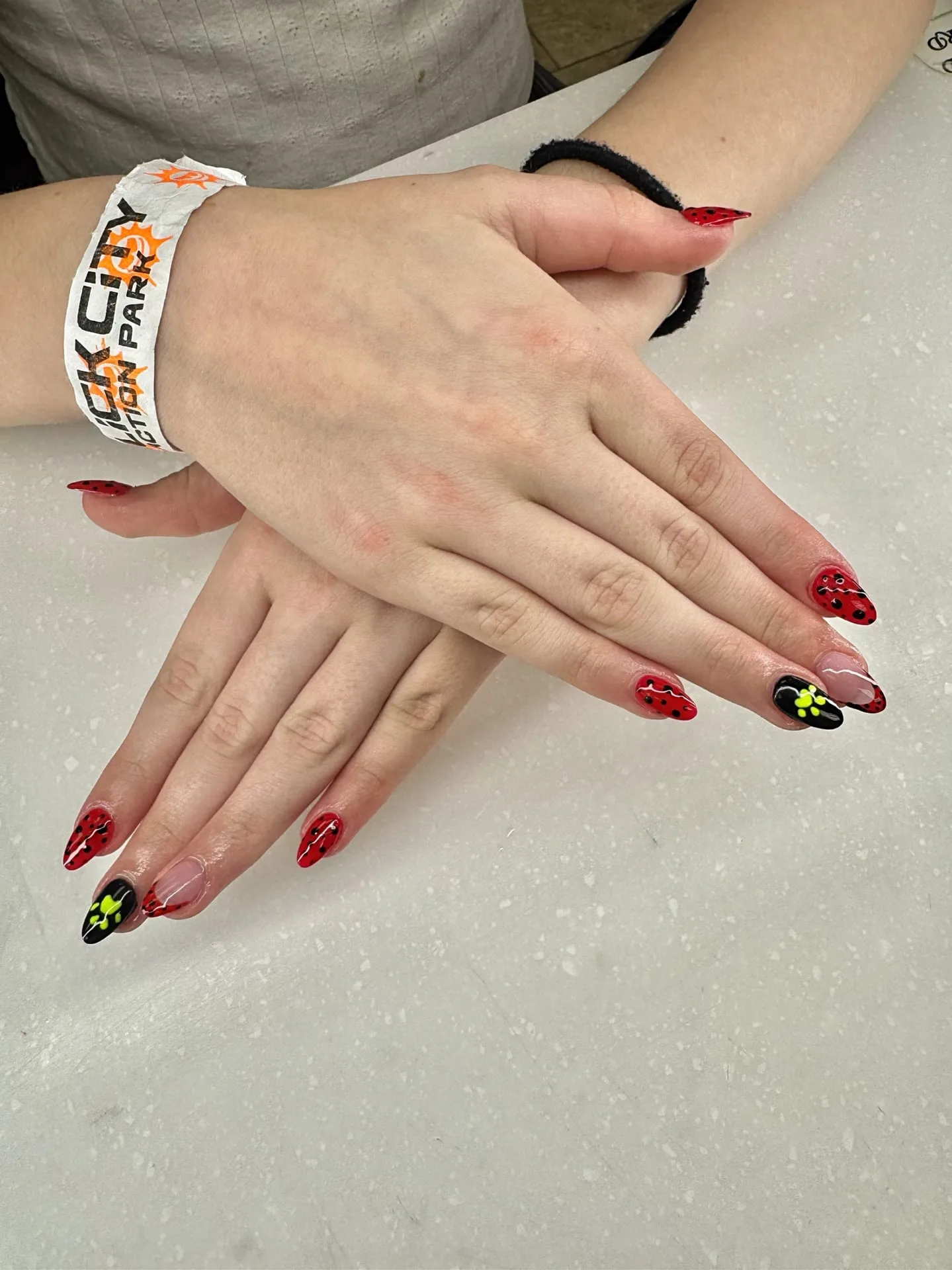 Girl's nails in purple polish finished at Perfect Nails Saint Paul