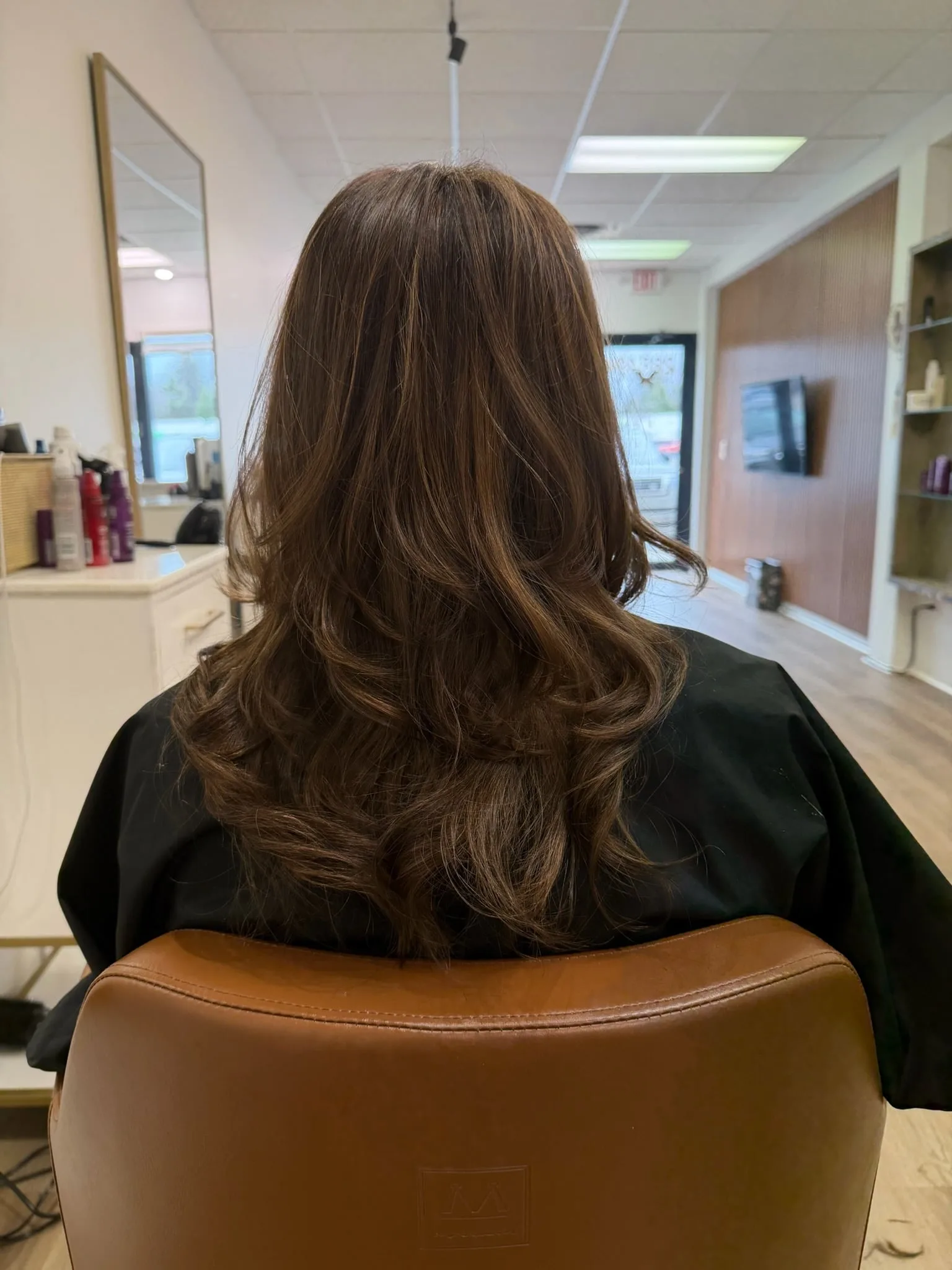 Precise root color application close-up at Salon Sanaa