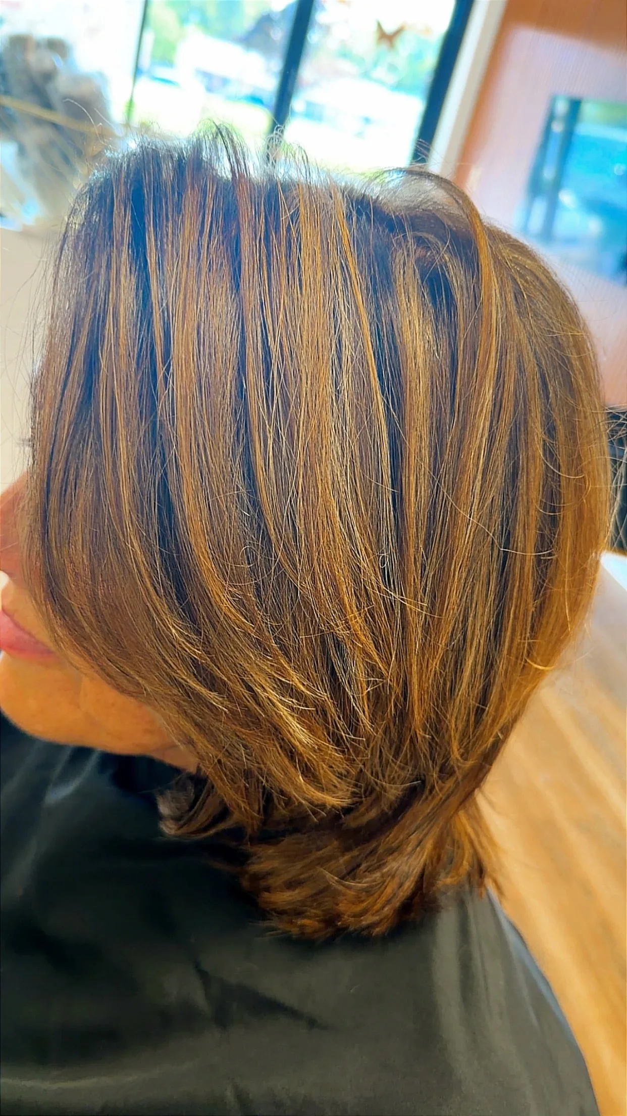 Rich, even hair tone and high shine after a gloss treatment at Salon Sanaa
