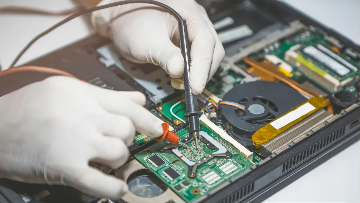 Laptop with the back panel removed for repair