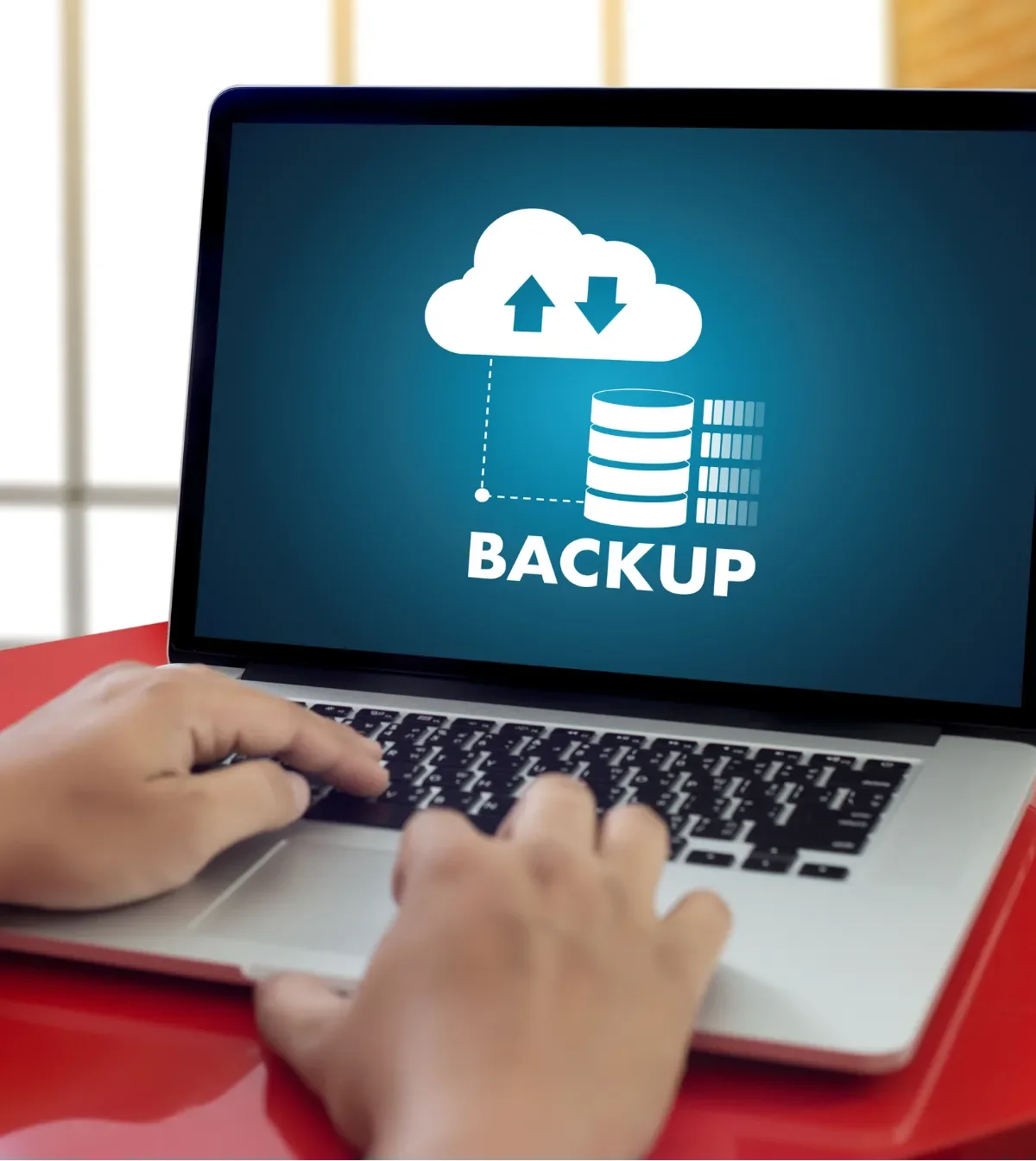 Technician checking a cloud backup dashboard for a small business
