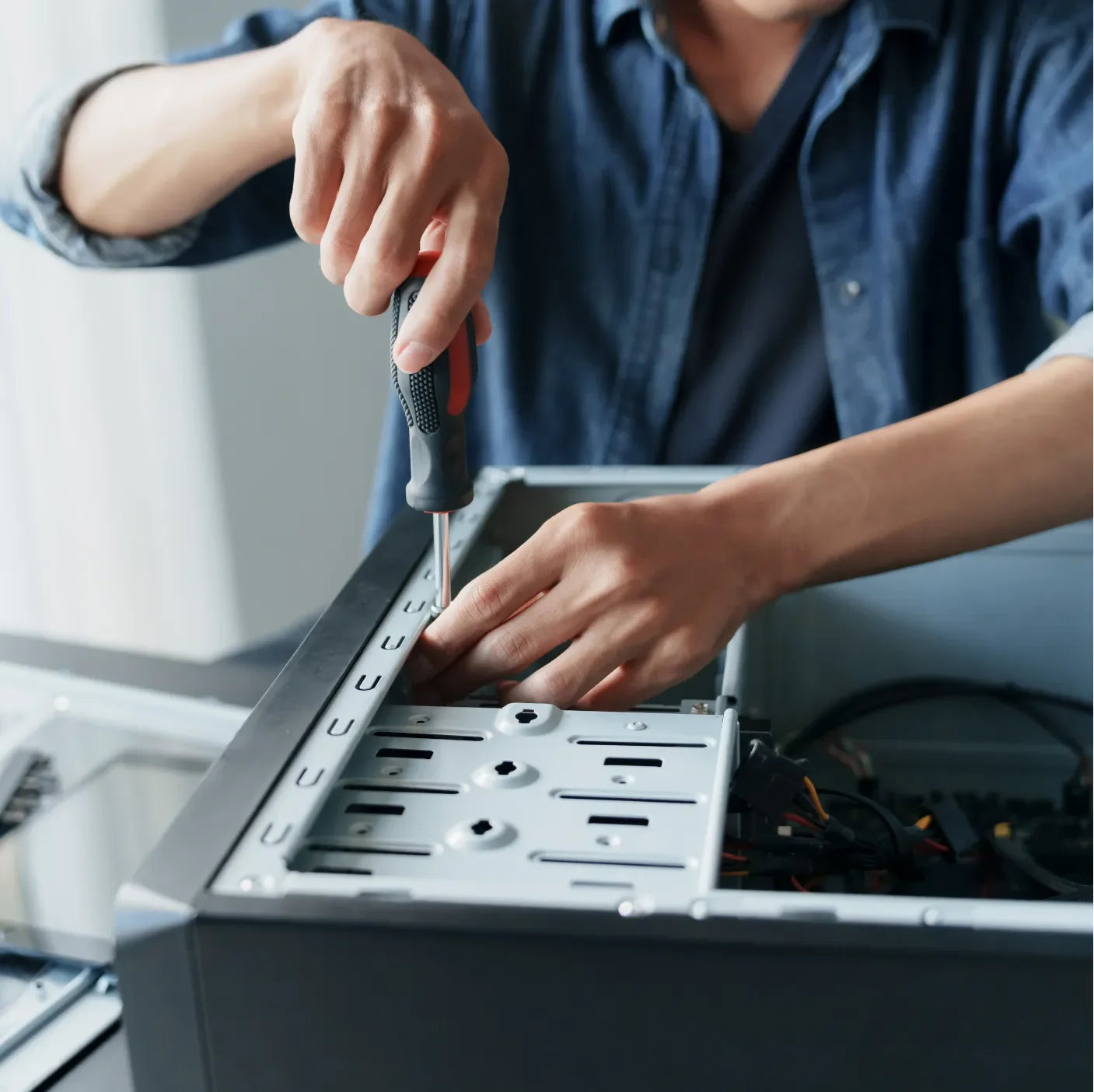 Technician setting up monitoring on an office computer